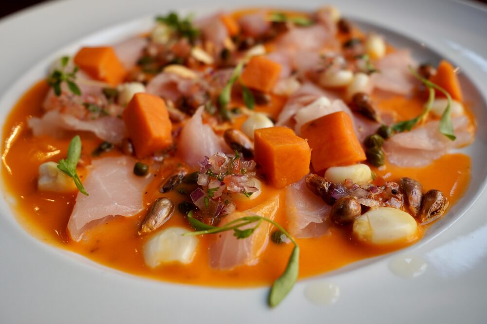 Take a break from budget travel and treat yourself to a local delicacy. Have you tried ceviche with leche de tigre?