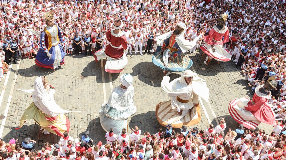 Embrace local culture by going to a festival, like San Fermin in Spain
