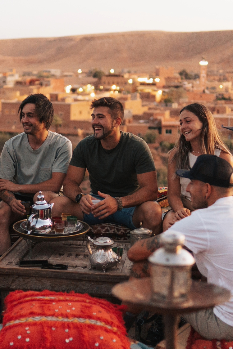 Group of Friends siting on a rooftop in Morocco